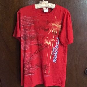 Red, yellow, white, blue tee shirt from Jimmy Buffet’s Margaritaville.